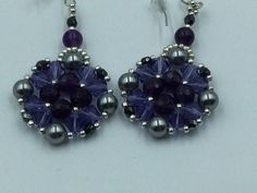 Beaded Swarovski Crystal Bicones and Glass Pearls  as well as Amethyst Gemstones used to make these beautiful dangling earrings. Beaded with a very strong beading thread to make your pretty, one of a kind earrings. Beaded Amethyst Earrings Gift, Beaded Amethyst Earrings For A Gift, Amethyst Beaded Earrings As Gift, Purple Crystal Earrings With Round Beads For Gift, Handmade Purple Crystal Earrings, Beading Thread, Your Pretty, Earrings Beaded, Dangling Earrings