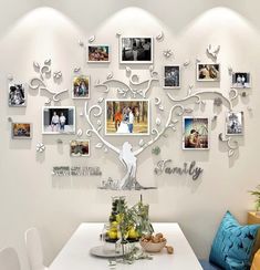 the family tree is hanging on the wall in this dining room with pictures and photos