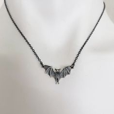 Detailed Bat Necklace.   Sterling Silver Charm 1" x 1/2" on delicate oxidized black sterling silver chain. Chain is 16" + 1.5" extender chain to adjust to your desired length with lobster claw.  Message us if you need a longer chain. Necklace is packaged on an Alexander & Quayle jewelry card inside a 3.5" x 3.5" white jewelry box. Free polishing cloth and sticker included. Makes a perfect gift! Black Halloween Jewelry With Adjustable Chain, Gothic Halloween Jewelry With Oxidized Finish, Halloween Gothic Jewelry With Oxidized Finish, Gothic Oxidized Jewelry For Halloween, Black Sterling Silver Necklace For Halloween, Black Gothic Jewelry With Oxidized Finish, Black Sterling Silver Necklace With Oxidized Finish, Sterling Silver Necklace With Oxidized Black Finish, Black Sterling Silver Nickel Free Charm Necklace