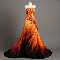 Catness Everdeen Fire Dress, Fire Elf Costume, Fire Dress Gowns Ball, Sunset Dress Gowns, Fire And Ice Formal Dress, Fire And Ice Prom Theme Dress, Autumn Inspired Fantasy Dress, Fire Inspired Gown, Flame Dress Gowns