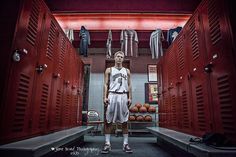 a basketball player standing in the locker room