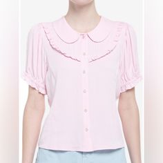 Your Outfit Will Be In Full Bloom With This Adorable Woven Button-Up! Add Something As Sweet As Cherry Blossoms To Your Wardrobe With This Pink Top, Featuring Sakura Buttons Down The Center, A Peter Pan Collar And Bib Detailing Along The Chest. Comes With Puffy Elasticated Sleeves And Princess Seams. 100% Rayon Wash Cold; Dry Low 22" Length Non Stretch Pink Sakura, Princess Seams, In Full Bloom, Pink Top, Princess Seam, Pan Collar, Peter Pan Collar, Cherry Blossoms, Pink Tops