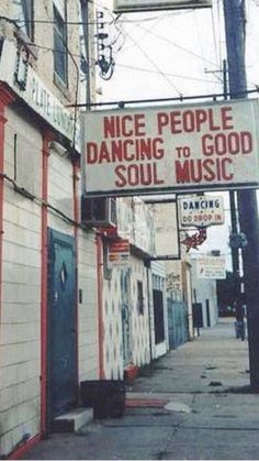 a sign that says nice people dancing to good soul music on the side of a building