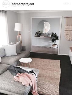 a living room filled with furniture and a rug