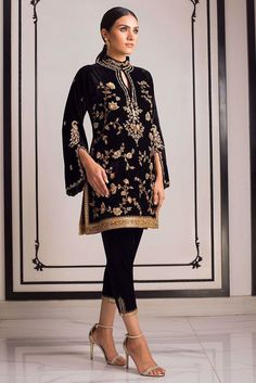 Black Embroidered Fabric For Designer Wear During Eid, Formal Traditional Floral Embroidered Sets, Traditional Formal Sets With Floral Embroidery, Traditional Floral Embroidered Formal Sets, Black Kurta With Gold Embroidery For Diwali, Formal Black Kurta With Floral Embroidery, Formal Embroidered Black Kurta, Black Kurta For Ceremonial And Transitional Seasons, Elegant Black Traditional Wear For Ceremonial Occasions