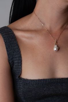 This necklace brings together the contrasting elements of delicate open oval links of 14Kt yellow gold chain, a charming toggle bar front closure, and a dramatic baroque teardrop pearl pendant to create a luxe piece with unique details. 14Kt Yellow Gold Long Link Chain 14x17mm Teardrop Baroque Pearl Length: 16" Made in L.A. Globally Sourced Materials Each pearl is unique, no two are exactly the same. Chic Teardrop Shaped Jewelry With Pearl Pendant, Chic Teardrop Pearl Pendant Jewelry, Timeless Baroque Pearl Jewelry, Elegant Oval Link Pearl Chain Jewelry, Elegant Toggle Necklace With Cable Chain For Formal Occasions, Elegant Toggle Necklace With Cable Chain For Formal Events, Elegant Necklace With Toggle Clasp For Formal Occasions, Elegant Pendant Toggle Necklace, Gold Toggle Necklace With Pearl Charm