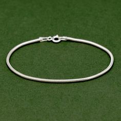 "Sterling Silver 1.6mm Snake Chain Anklet, 8.5\", 10\", Minimalist Anklet, Dainty Anklet, Silver Anklet, Chain Link Anklet, Gift for Her Introducing our stunning Sterling Silver 1.6mm Snake Chain Anklet, available in two lengths: 8.5 inches or 10 inches. This delicate and minimalist anklet is the perfect accessory to add a touch of elegance to any outfit. Crafted with the highest quality sterling silver, this anklet features a stylish chain link design that is both fashionable and versatile. The dainty nature of this anklet makes it a great piece for everyday wear or to be worn on special occasions. It effortlessly complements any style, from casual to more dressed-up looks. Its simplicity allows it to be easily paired with other bracelets or anklets for a layered look. This silver anklet Silver Minimalist Anklets For Gift, Silver Minimalist Metal Anklets, Sterling Silver Anklet With Silver Chain For Gift, Minimalist Silver Anklets With Adjustable Chain, Silver Adjustable Chain Metal Anklet, Silver Anklets Designs, Anklet Designs, Silver Anklets, Chain Anklet