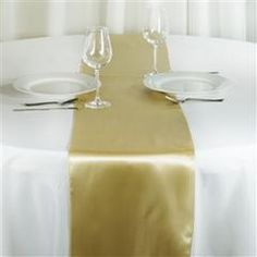 the table is set with two empty wine glasses