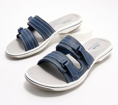 Sporty, flexible, and durable, these breezy slide sandals are ideal for beach-strolling and days about town. From Clarks Collection. Outdoor Slide Sandals With Arch Support, Comfortable Slide Sandals For Outdoor, Adjustable Flat Slides For Outdoor, Adjustable Slides With Ortholite Insole For Outdoor, Adjustable Outdoor Slides With Ortholite Insole, Adjustable Footbed Slide Sandals For Outdoor, Adjustable Slide Footbed Sandals For Outdoor, Beach Slide Slippers With Ortholite Insole, Flat Beach Slides With Ortholite Insole