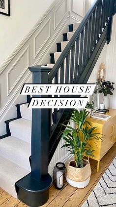 a staircase with the words best house decision on it and a potted plant next to it