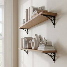 two shelves with books and vases on them