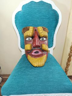 "This is a beautiful mask of the dance of the \"Moros Chinos\", originally from the municipality of Zitlala in the state of Guerrero, it is large in size. It is a beautiful mask made of wood that has a red face, has incredible eyebrows carved in the wood in an \"L\" shape, it also has a beard and lines in the shape of an \"I\" on the sides of the cheek that they are yellow. You can see the age and use of the mask on the back, it also has some pieces of brown plush fabric on top of the mask. This Traditional Masks And Prosthetics For Carnival, Traditional Carnival Masks And Prosthetics, Traditional Masks And Prosthetics For Festivals, Traditional Full Face Carnival Masks, Traditional Festival Masks And Prosthetics, Handmade Traditional Mask, Devil Mask, Red Face, Beautiful Mask