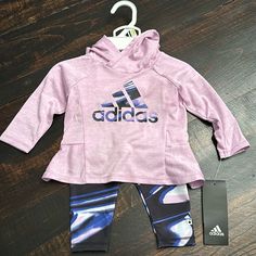 New With Tags! Adidas Baby Girl 2-Piece Set. Sporty & Stylish. Longsleeve Hooded Top With Leggings. Adidas Logos On Front Of Shirt And Left Ankle. Colors - Light Purple, Navy Blue, Black And White. 100% Polyester. Sporty Long Sleeve Playtime Sets, Playful Purple Long Sleeve Sets, Adidas Pink Playwear Sets, Adidas Pink Long Sleeve Sets, Purple Cotton Playwear Sets, Purple Long Sleeve Tops For Playtime, Cute Purple Long Sleeve Sets, Pink Adidas Cotton Set, Adidas Pink Sets For Spring