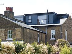 a large brick building with lots of windows