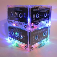 there are three cassettes stacked on top of each other with lights in the middle