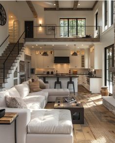 a living room filled with furniture and a fire place in the middle of a kitchen