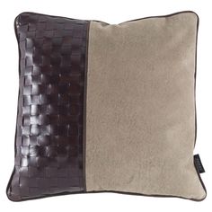 a brown and tan pillow with two contrasting sides on the same pillow cover, one side is