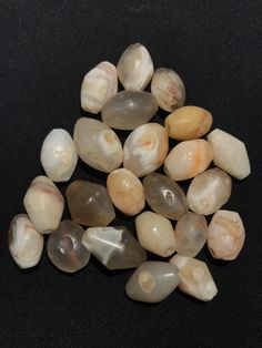 A beautiful string of Bended white agate natural found from Afghanistan dating 1800 yrs. They are found at that time in Afghanistan mostly but also some found in India and Pakistan too. They were used as a special charm jewellery by the affluents at that time period. Beautiful counter bronze are decorated further in between the beads. White Natural Stones Beads For Healing, White Gemstone Beads For Jewelry Making, White Agate Jewelry With Polished Beads, Natural Stone Oval Beads Amulet, Natural Stone Oval Amulet Beads, White Polished Beads Gems And Cabochons For Gifts, Handmade White Agate Beads, White Beads For Jewelry Making, Agate Amulet Beads For Jewelry Making