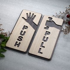 two wooden signs with the words push and pull on them