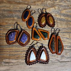 Hand picked matching stones inlayed in English tanned leather with a wax finish - stainless steel hooks and bails -English (rust color) tanned -Wax finish coat -Double leather totaling 6oz thickness $Find more of my rustic hand made designs https://www.etsy.com/shop/KCsDesignsShop #Message for coupons and sale codes if you can't find them on-site. Bohemian Hand-tooled Leather Earrings, Artisan Hand-tooled Teardrop Earrings, Rustic Hand Tooled Leather Jewelry, Unique Brown Teardrop Earrings, Handmade Leather Brown Earrings, Handmade Brown Leather Earrings, Handmade Rustic Leather Earrings, Handmade Rust Leather Jewelry, Unique Brown Nickel-free Jewelry