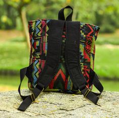 "Square lightweight backpack made from quality soft durable tribal styled woven fabrics, lightly foam interfaced, then blended with complimenting colored cotton and fully lined with black cotton This backpack is perfect for an iPad, books or a generally just on the go, space for your wallet, diapers or a trip to the park when you don't want to carry a bag or need both your hands free, The stylish color and fabric combinations make it unique and perfect for almost any occasion and its size makes Multicolor Rectangular Backpack For Outdoor Activities, Rectangular Multicolor Backpack For Outdoor Activities, Multicolor Backpack With Adjustable Strap For Outdoor Activities, Multicolor Rectangular Backpack For Trip, Multicolor Backpack With Adjustable Strap For Festivals, Multicolor Rectangular Backpack For Festivals, Multicolor Backpack Shoulder Bag For Outdoor, Bohemian Rectangular Backpack For Festivals, Bohemian Multicolor Travel Backpack