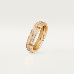 a yellow gold ring with diamonds on the inside and outside, set against a white background