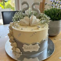 a birthday cake with flowers and decorations on top