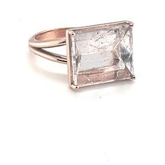 Mirror cut Morganite ring  A ethereal 8 carat light pink morganite sits in a simple 10k rose gold setting.  Light bounces off the inside of the stone creating a stunning mirror like shine.  Size 7 available or I can size it up or down 2 sizes at no extra charge. Please inquire about this service. Rose Gold Baguette Cut Ring With Rose Cut Diamonds, Emerald-cut Topaz Ring In Rose Gold, Rose Gold Emerald-cut Topaz Ring, Emerald Cut Topaz Ring In Rose Gold, Rose Gold Emerald Cut Topaz Ring, Morganite Solitaire Ring In Rose Gold, Rose Gold Morganite Solitaire Ring, Rose Gold Solitaire Topaz Ring For Formal Occasions, Rose Gold Square Cut Fine Jewelry Ring