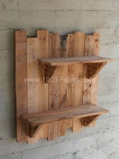 two wooden shelves mounted to the side of a wall