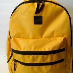 Brand New With Tag Backpack Bag Purse Made Of Nylon Canvas Yellow Color Black Details Three Zipper Compartments Two Zipper Pockets On The Front Two Slip Pockets On The Sides Short Handle On The Top Dual Adjustable Shoulder Back Straps Lined Interior: Slip Tablet Pocket & Zip Pocket Approximate Measurements: 12.5"L 17.5"H 6"W Pet & Smoke Free Home Please See My Entire Collection Yellow Backpack For Back To School With Zipper, Back To School Yellow Backpack With Zipper Closure, Back To School Yellow Backpack With Zipper, Vans Bags For Back To School, Vans Bags For Students Back To School, Functional Vans Backpack, Casual Vans Backpack For Everyday Use, Vans Functional Backpack For Back To School, Casual Vans Bag For Students