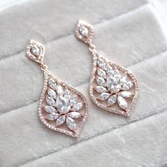 Simple Rose gold Bridal chandelier earrings - CAMILLA - Treasures by Agnes Dazzling Rose Gold Cubic Zirconia Bridal Earrings, Glamorous Rose Gold Cubic Zirconia Crystal Earrings, Glamorous Rose Gold Crystal Earrings With Cubic Zirconia, Rose Gold Sparkling Cubic Zirconia Earrings, Sparkling Rose Gold Cubic Zirconia Earrings, Elegant Rose Gold Crystal Chandelier Earrings, Elegant Rose Gold Chandelier Earrings With Cubic Zirconia, Rose Gold Bridal Earrings With Sparkling Cubic Zirconia, Glamorous Rose Gold Cubic Zirconia Bridal Earrings