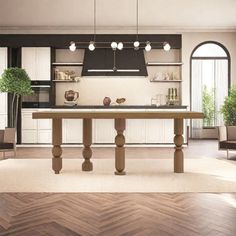 an open kitchen and dining room with wood flooring