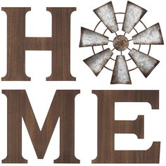 the word home is made out of wood and has an iron windmill on it's side