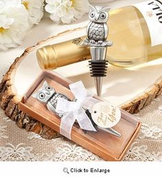 an owl wine bottle stopper and corkscrew set in a wooden box on a lace tablecloth