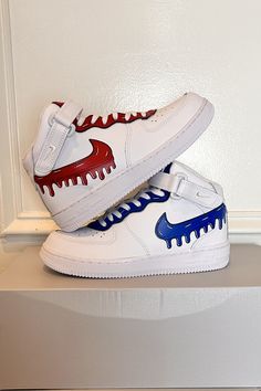 Custom sneakers with bold red and blue dripping Swoosh designs and cartoon-inspired accents for a fun, eye-catching style. Perfect for making a unique statement! Click to order your custom pair. #CustomSneakers #DripDesign #DrippingSwooshes