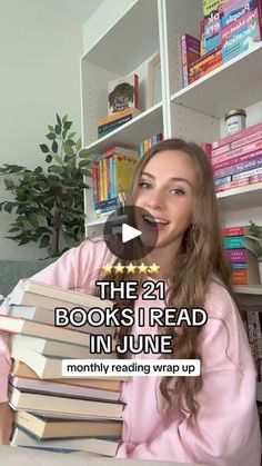 a woman sitting at a table with books in front of her and the caption reads, the 21 books i read in june