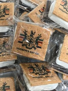 several pieces of crackers wrapped in plastic and sitting on top of each other with the words hudson's bay company printed on them