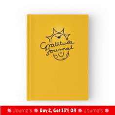 a yellow journal with the words gratitude journal written on it