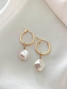 **Each piece in my shop, I personally create and photograph. (All photos are property of The Cord Gallery LLC) Thank you for supporting my small business.Dainty Gold Filled Hoop Earrings with Pearl CharmsThese beauties feature 14k Gold Filled hoop earrings adorned with genuine pearl charms. Pearl charms are removable so these are a 2 in 1 set. All components are gold filled. You will receive one pair of earrings (2 earrings)•Hoops are Gold Filled and measure 14mm Luxury Pearl Charm Earrings For Everyday Elegance, Minimalist Pearl Charm Hoop Earrings, Modern Pearl Jewelry, Earrings Hoops, 2 Earrings, Gold Filled Hoops, Jewelry Minimalist, Chunky Bracelets, Cute Rings