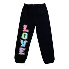 Girls Sweatpants, Varsity Sweatpants, Girls Sweats, Cute Girls Pants, Lounge Pants, Cool Sweatpants, Joggers, Birthday Gift, School Clothes These sweatpants are super cute and trendy! Gold glitter outlined LOVE on black sweats, perfect for school or play! Great with a sweatshirt, t-shirt and denim jacket, or long sleeve tee!  *Sweatpants are unisex **Available in adult sizing - send us a message.  Please Read Before Purchase!  If you are looking for something specific and don't see it in my stor Cute Cotton Bottoms With Letter Print, Trendy Multicolor Bottoms With Letter Print, Multicolor Cotton Bottoms With Letter Print, Playful Bottoms With Elastic Waistband For School, Sporty Multicolor Bottoms With Letter Print, Girl Sweat, Girl Sweatpants, Black Sweats, Kids Pants