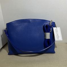 Nwt Viola Castellani Pebble Italian Satchel Leather Dual Entry Satchel Detachable Straps Large Zip Open Section With Magnetic Snap On Closure Silvertone Hardware 3 Inside Pockets Color Blue , Msrp $199 14”W X 10” H X 5”D Formal Blue Shoulder Bag With Silver-tone Hardware, Blue Evening Bag With Silver-tone Hardware, Blue Satchel With Adjustable Strap For Formal Use, Evening Blue Bags With Silver-tone Hardware, Blue Evening Bags With Silver-tone Hardware, Blue Evening Shoulder Bag, Elegant Blue Satchel With Silver-tone Hardware, Blue Top Handle Satchel With Silver-tone Hardware, Blue Top Handle Shoulder Bag With Silver-tone Hardware