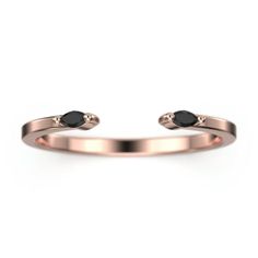 a rose gold ring with two black stones