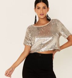 Silver Sequin Cropped length Short sleeves Scoop neck Embellished sequin design Fitted Crew Neck Crop Top For Party, Glamorous Stretch Top With Contrast Sequin, Short Sleeve Sequin Crop Top For Party, Spring Party Crop Top With Crew Neck, Sequined Short Sleeve Crop Top For Night Out, Sequin Stretch Blouse For Night Out, Stretch Sequined Blouse For Night Out, Stretch Sequin Blouse For Party Season, Chic Party Crop Top With Crew Neck