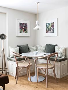 a living room with white walls and wooden floors