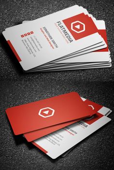 two red and white business cards sitting on top of each other, with the letter c in