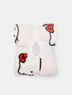 the hello kitty pillow is white with red and black designs on it's sides