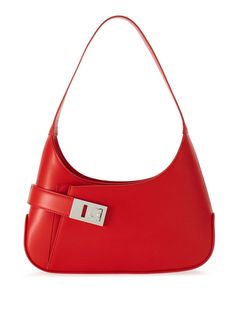 Find SALVATORE FERRAGAMO Medium Hobo Shoulder Bag on Editorialist. This Ferragamo shoulder bag is crafted from calf leather and features palladium-tone hardware, a Gancini buckle, tonal stitching, and a top zip fastening. It includes a single shoulder strap, a main compartment, internal card slots, an internal logo stamp, a front patch pocket, and a leather lining. The bag can be worn on the shoulder. Red Evening Shoulder Bag With Silver-tone Hardware, Red Shoulder Bag With Silver-tone Hardware For Evening, Elegant Red Handheld Hobo Bag, Luxury Red Baguette Bag, Rectangular Baguette Bag With Palladium Hardware, Red Satchel Shoulder Bag With Palladium Hardware, Modern Red Shoulder Bag With Silver-tone Hardware, Chic Red Shoulder Bag With Palladium Hardware, Red Rectangular Hobo Bag With Gold-tone Hardware