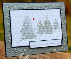 a christmas card with a red bird on the snowy trees and snowflakes in the background