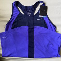 Light Weight Black Moisture-wicking Tank Top For Light Sports, Moisture-wicking Tank Top For Light Sports With Medium Support, Purple Workout Tops With Built-in Bra, Black Nike Shirt, Nike Tops Women, Purple Moisture-wicking Tank Top For Sports, Nike Running Shirt, Nike Moisture-wicking Sportswear Tank Top, Nike Tank