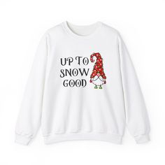 A funny Christmas-themed sweatshirt that says 'up to snow good' with an elf wrapped up in Christmas lights. This cozy sweatshirt is perfect for the colder months and adds a touch of humor to your winter wardrobe. Ideal for those who enjoy festive attire during the holiday season. Product features - - Knit in one piece without side seams for reduced fabric waste and a more attractive garment - - Ribbed knit collar with seam for elasticity and shape retention - - Made with a medium-heavy fabric blend of 50% cotton and 50% polyester for a cozy feel - - Classic fit and crew neckline for a comfy wearing experience - - Ethically grown US cotton and OEKO-TEX-certified dyes for sustainability and comfort Care instructions - Machine wash: cold (max 30C or 90F) - Non-chlorine: bleach as needed - Tum Festive Attire, Fabric Waste, Funny Holiday, Winter Pullover, An Elf, Holiday Humor, Holiday Sweater, Cozy Sweatshirts, Knit Collar